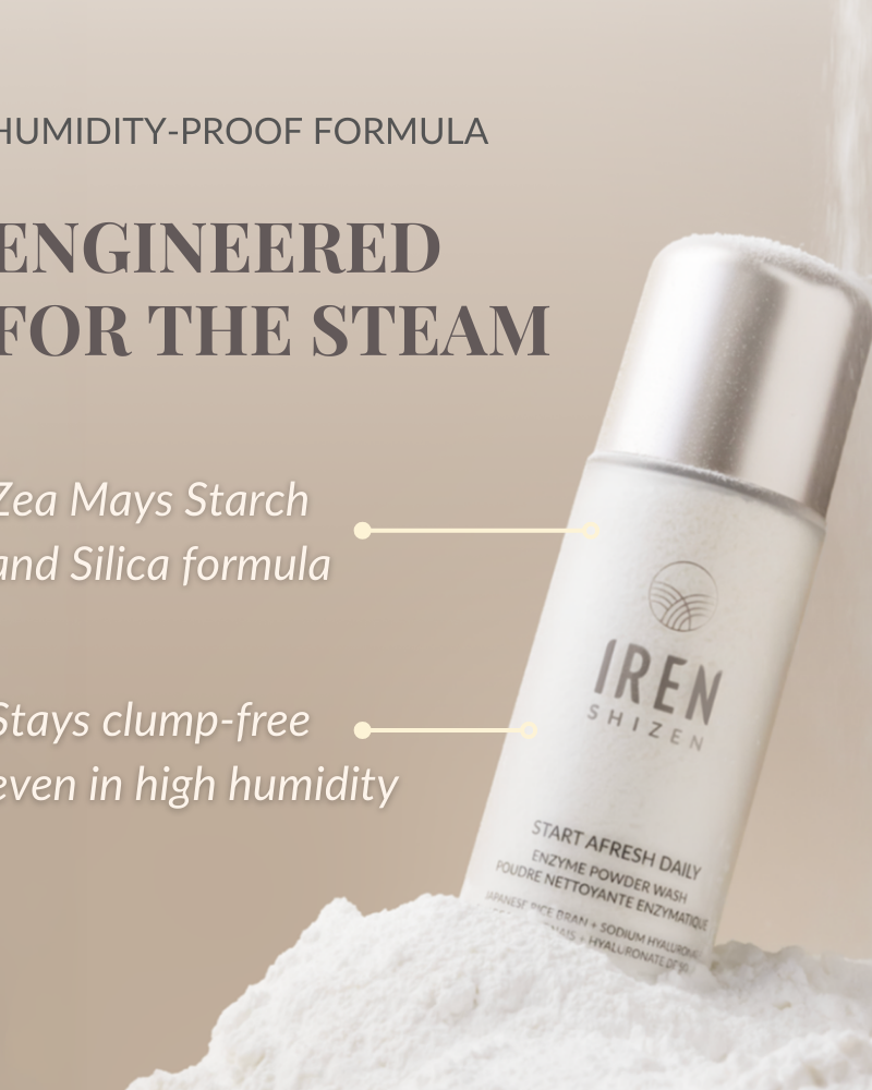 A bottle of IREN Shizen START AFRESH DAILY Enzyme Powder Wash stands on a mound of powder, highlighting its clump-free, waterless cleanser and gentle daily exfoliator formula—effective even in high humidity.