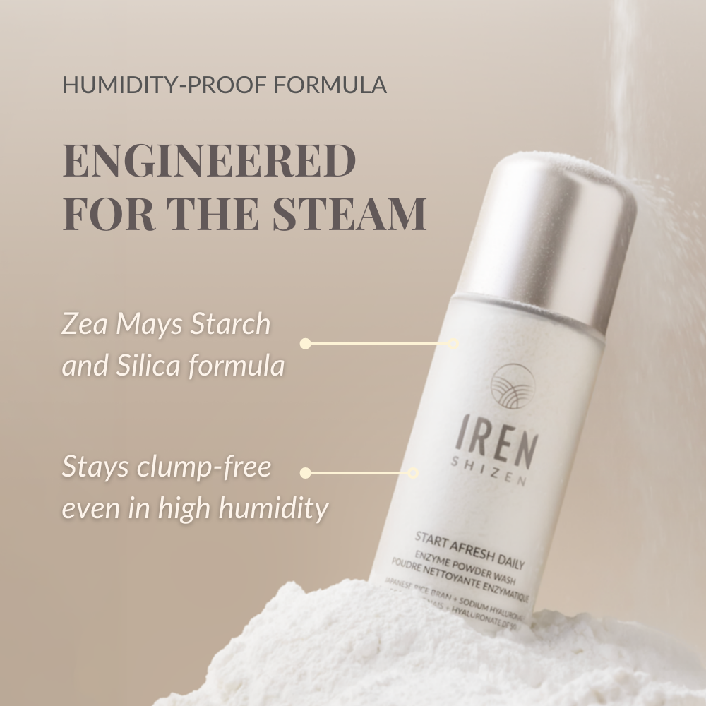 A bottle of IREN Shizen START AFRESH DAILY Enzyme Powder Wash stands on a mound of powder, highlighting its clump-free, waterless cleanser and gentle daily exfoliator formula—effective even in high humidity.
