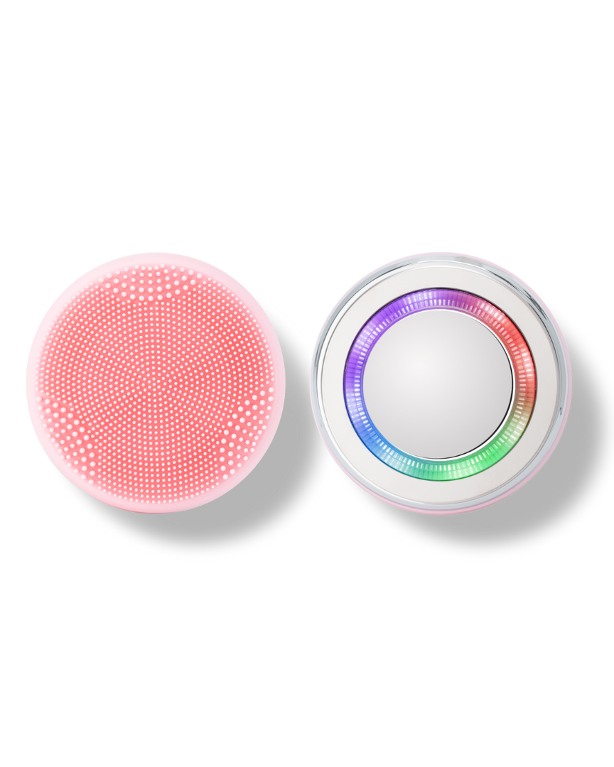 A pink and white SKIN GENIE PRO Cleansing Brush + LED Light Therapy button on a black background, offering customized skincare.