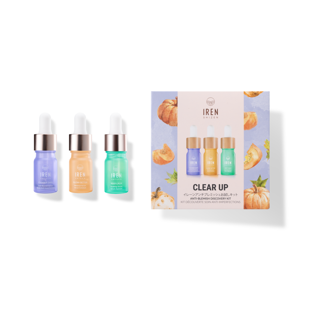 Three dropper bottles in blue, yellow, and green sit beside a boxed "FREE GIFT Discovery kit" by IREN Shizen, with matching bottle colors and pumpkin illustrations on the packaging.