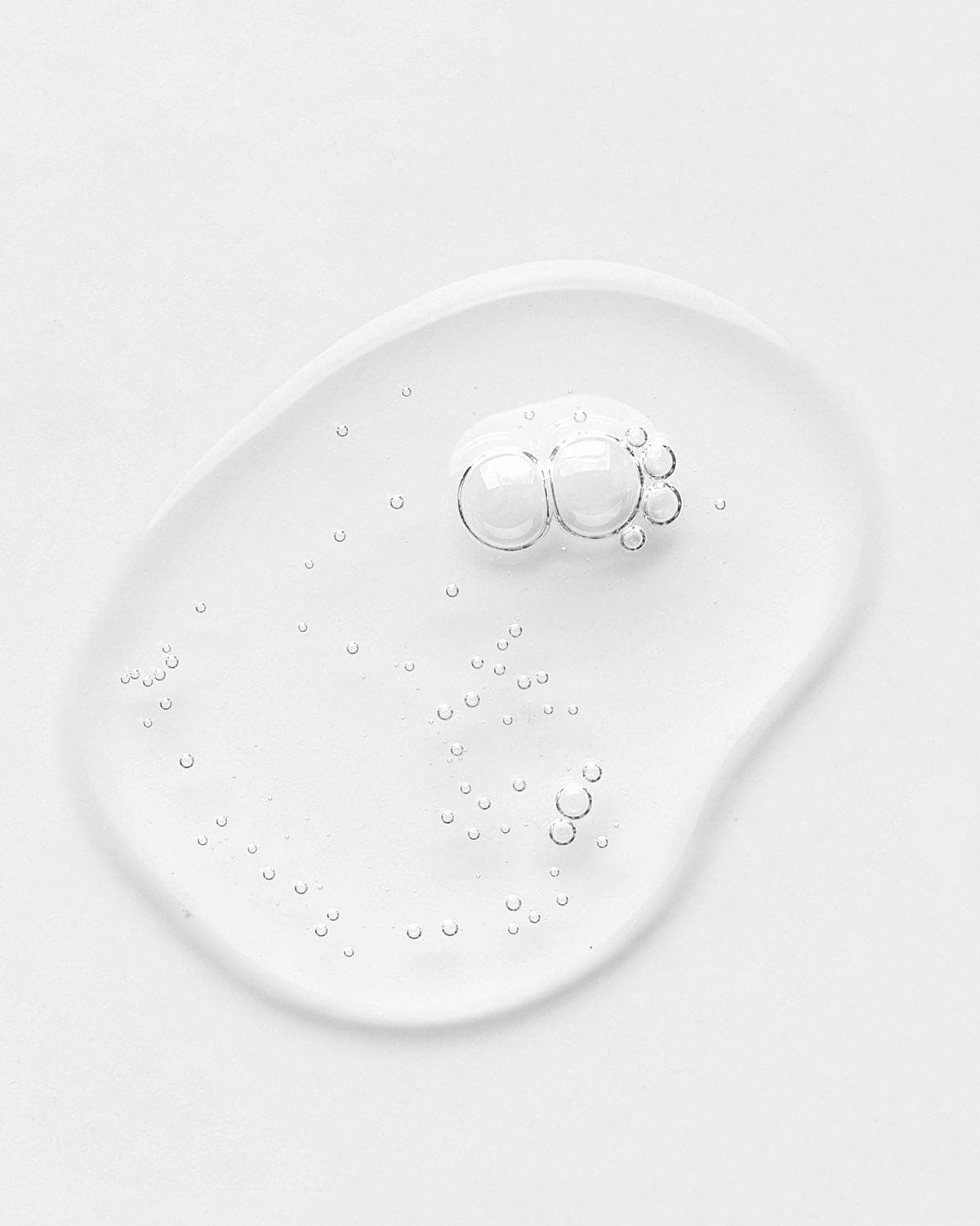 An image of STAR LIGHT Brightening Serum by IREN Shizen, a white liquid, showcasing Japanese skincare.