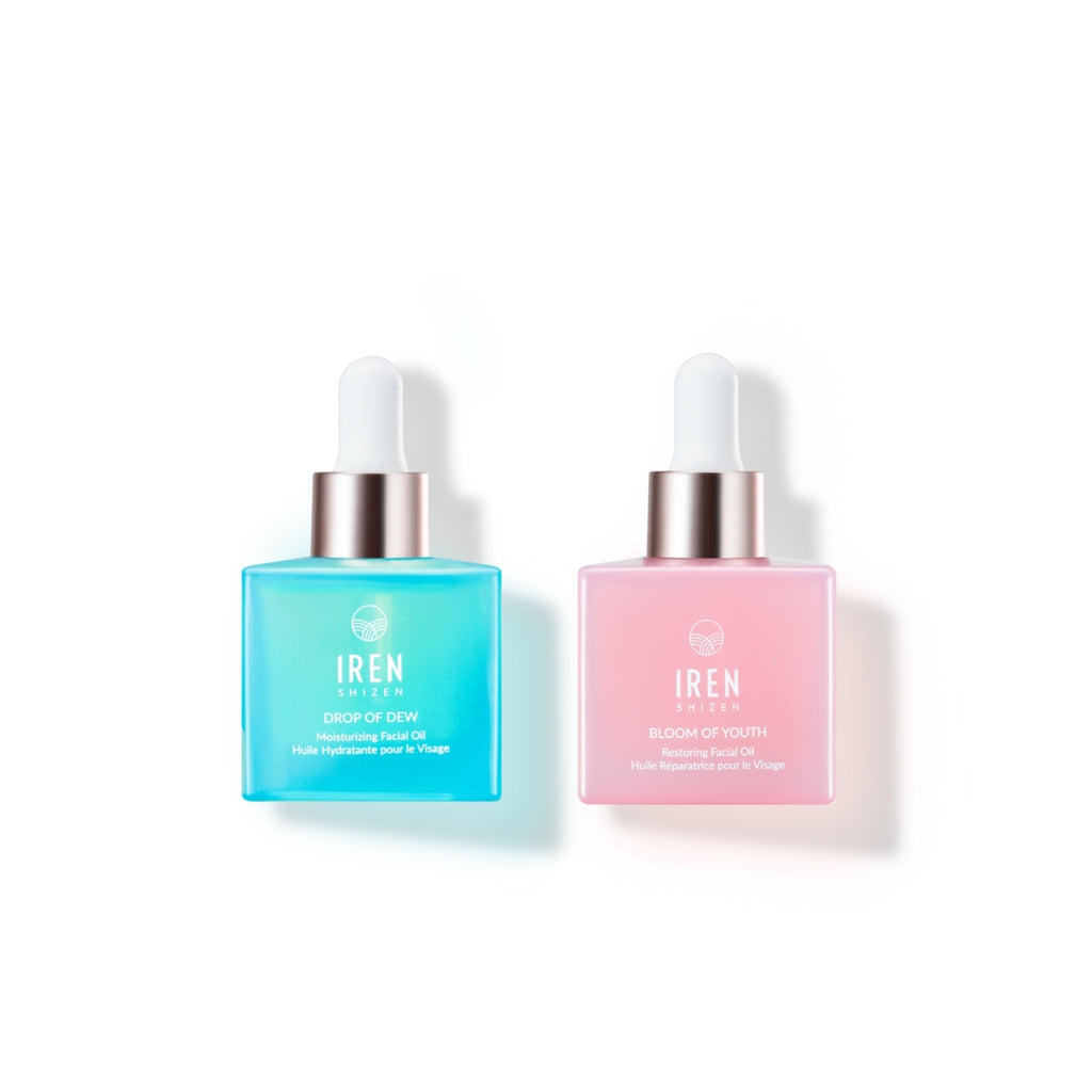 Two bottles of MICROBIOME REPAIR Pre and Postbiotic Facial Oils by IREN Shizen with blue and pink liquids on a white background.
