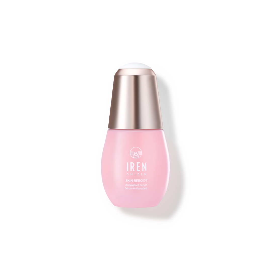 A customized onsen skincare serum in a pink bottle with a pink cap on a black background.