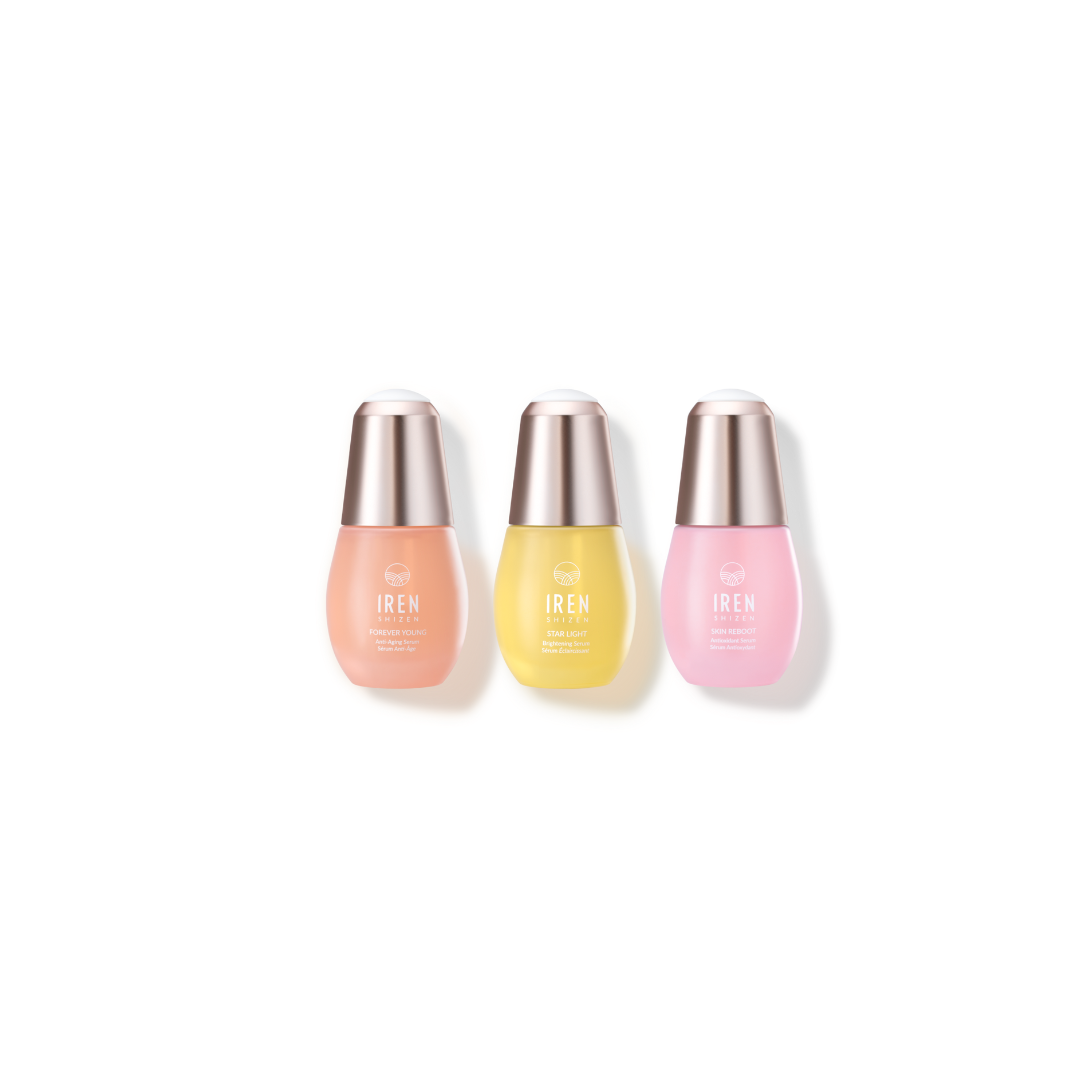 Three "Mix & Match" facial serums by Fast Bundle, in peach, yellow, and pink with silver caps, are arranged in a row.